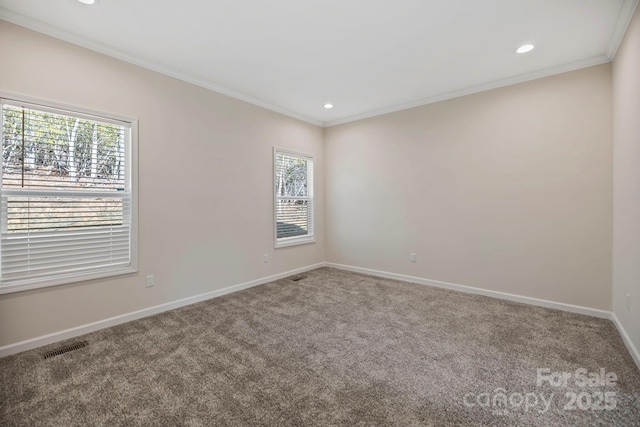 unfurnished room featuring recessed lighting, visible vents, baseboards, ornamental molding, and carpet