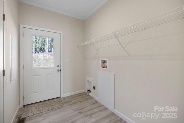 laundry area featuring hookup for a washing machine, light wood-style flooring, ornamental molding, laundry area, and baseboards