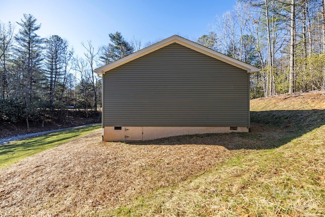 view of side of home featuring crawl space