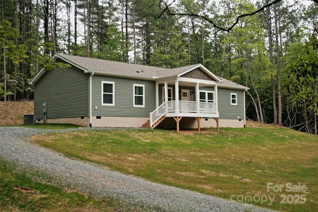 1663 Williamson Creek Rd, Pisgah Forest, NC 28768 - view of front of house with covered porch, a front yard, driveway, view of wooded area, and crawl space