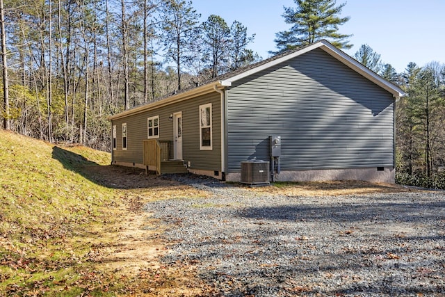 1663 Williamson Creek Rd, Pisgah Forest, NC 28768 - view of home's exterior featuring crawl space and central AC unit