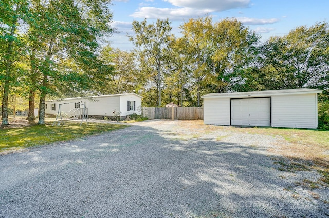 view of yard with an outbuilding and a garage