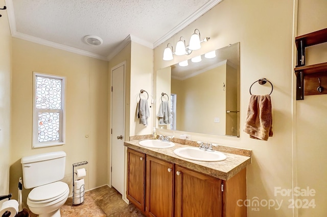 bathroom featuring vanity, crown molding, a textured ceiling, and toilet