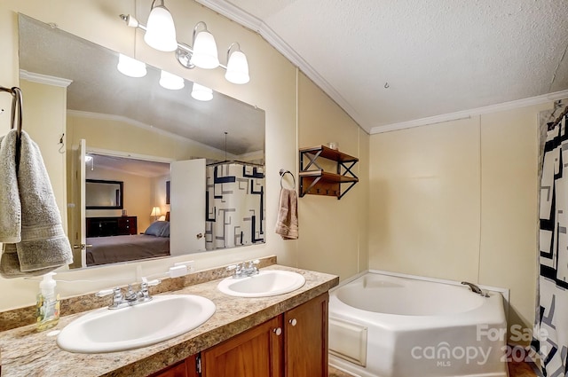 bathroom with vanity, crown molding, a textured ceiling, and lofted ceiling