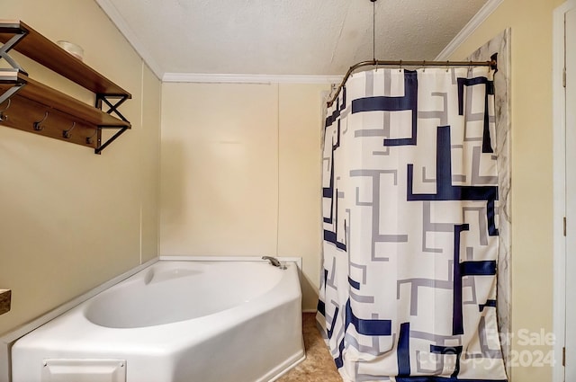 bathroom with crown molding and a textured ceiling