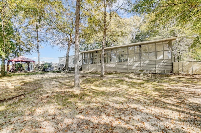 view of front of property with a gazebo and a sunroom