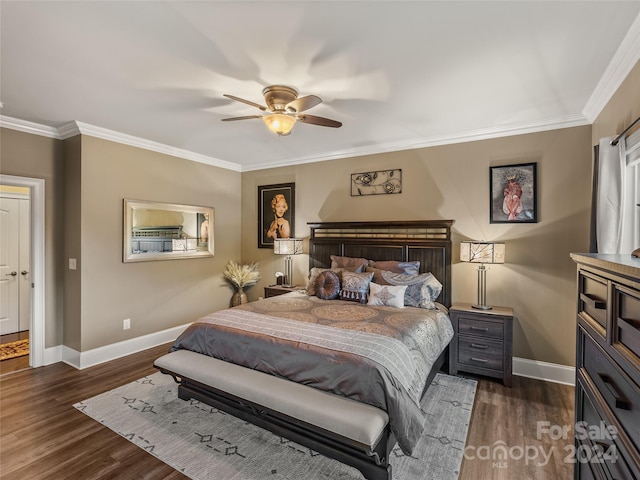 bedroom with ceiling fan, ornamental molding, and dark wood-type flooring