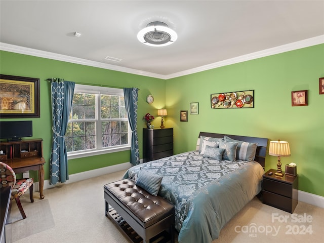 bedroom with light colored carpet and ornamental molding