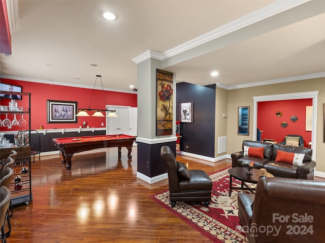 living room with crown molding, dark hardwood / wood-style flooring, and billiards