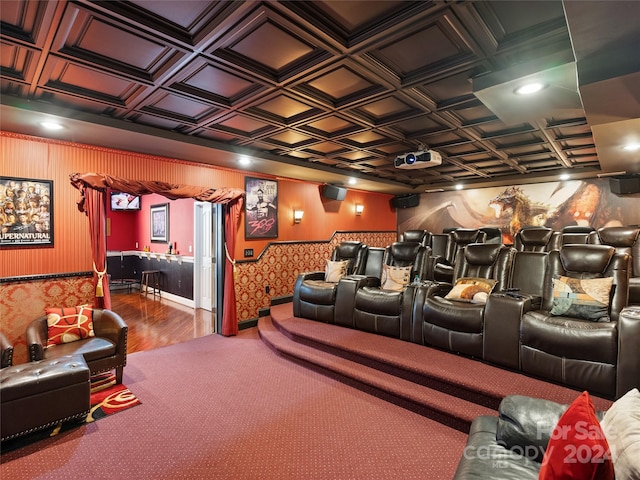 home theater room with hardwood / wood-style floors and coffered ceiling