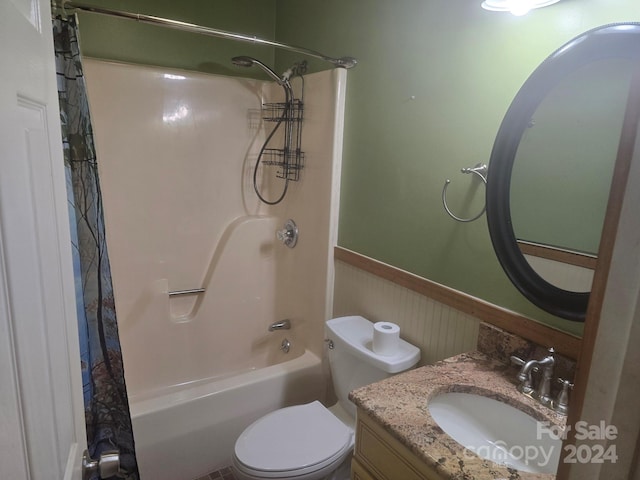 full bathroom featuring toilet, shower / bath combo, and vanity