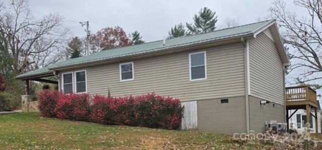 view of property exterior with a yard