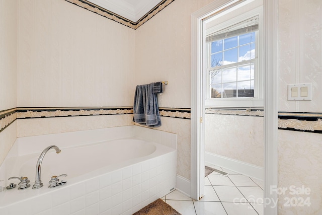 bathroom featuring crown molding, a tub, and tile patterned flooring