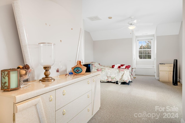 carpeted bedroom with lofted ceiling and ceiling fan