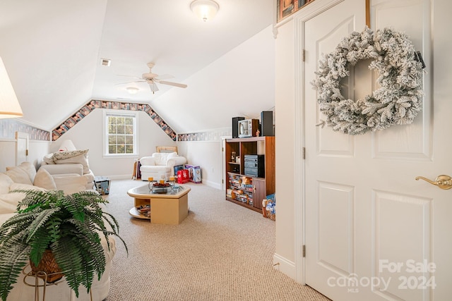 living room with carpet, vaulted ceiling, and ceiling fan