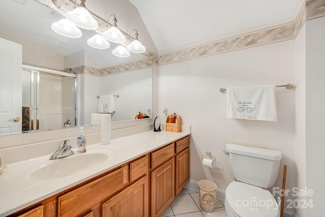 bathroom featuring walk in shower, vaulted ceiling, toilet, vanity, and tile patterned floors