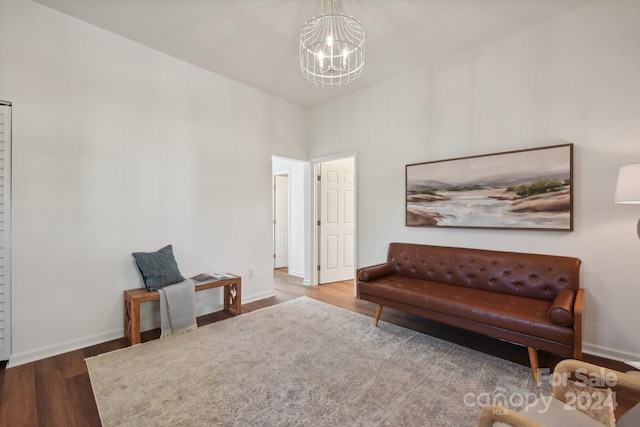 sitting room featuring hardwood / wood-style flooring and a chandelier