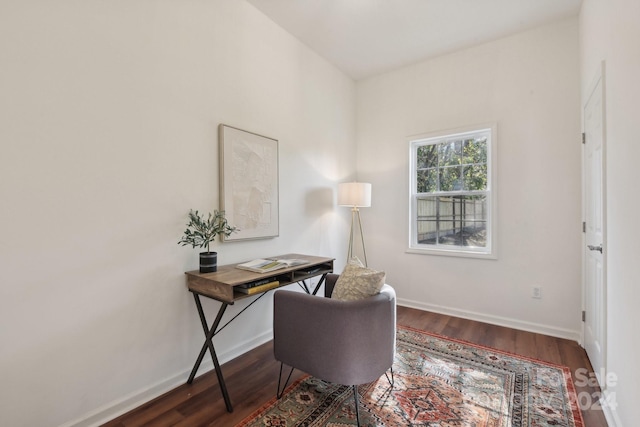 home office with dark hardwood / wood-style flooring