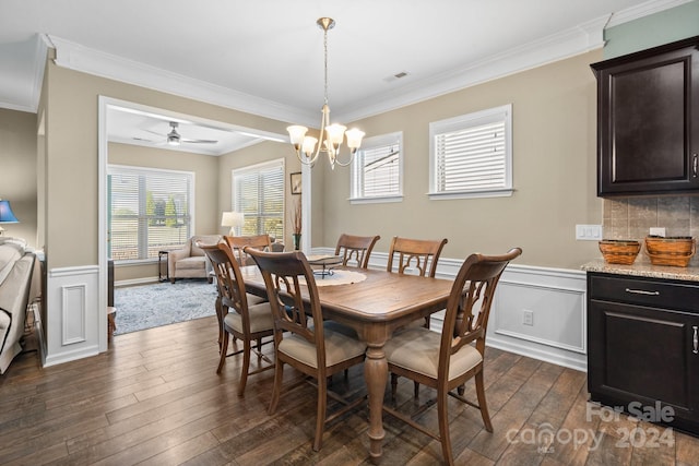 dining room featuring ceiling fan with notable chandelier, plenty of natural light, and dark hardwood / wood-style flooring