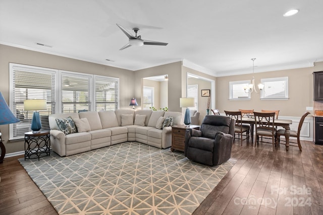 living room with ornamental molding, hardwood / wood-style flooring, and ceiling fan with notable chandelier