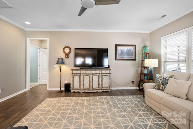 living room featuring ceiling fan, ornamental molding, and dark hardwood / wood-style flooring