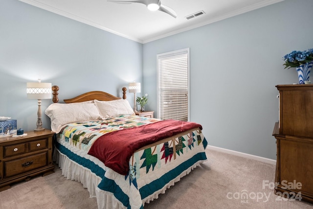 carpeted bedroom with crown molding and ceiling fan