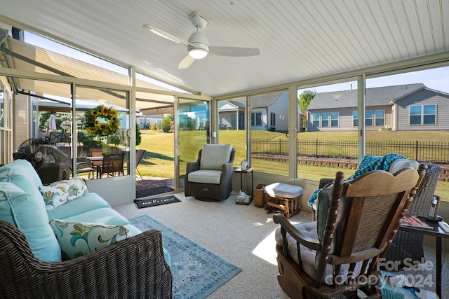 sunroom with lofted ceiling and ceiling fan