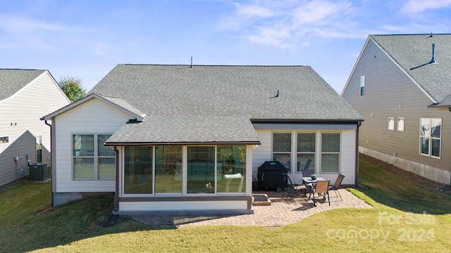 back of house featuring a yard, a patio area, and central AC unit