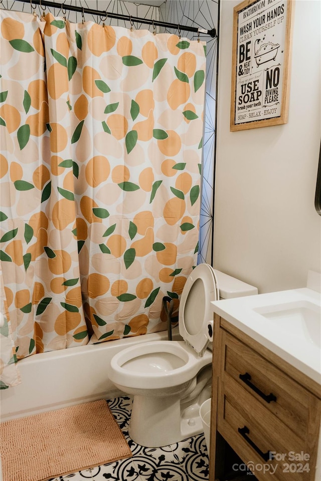 full bathroom featuring vanity, tile patterned floors, toilet, and shower / tub combo