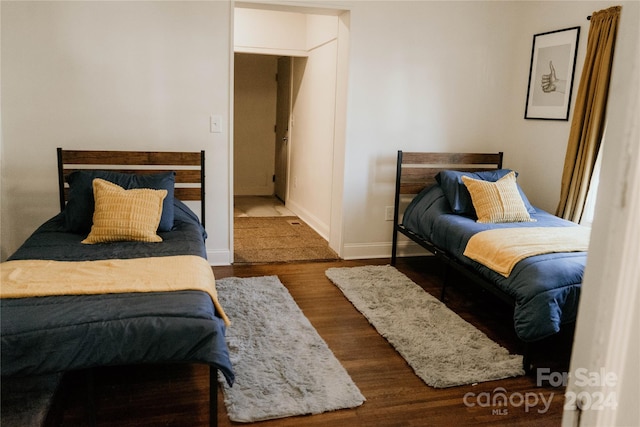 bedroom featuring dark hardwood / wood-style flooring