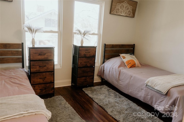 bedroom featuring dark hardwood / wood-style flooring