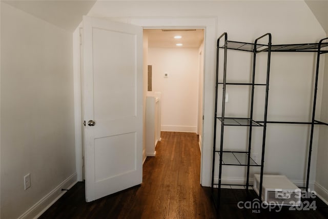 hall with dark hardwood / wood-style flooring