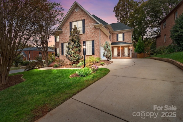 view of front property featuring a porch and a lawn