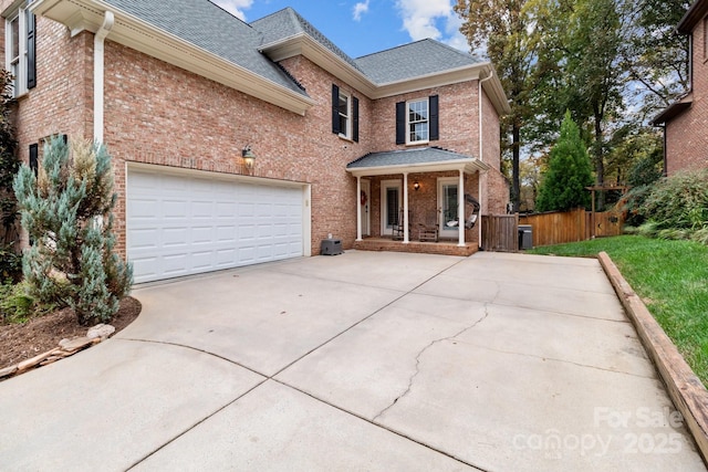 front of property featuring a garage and covered porch