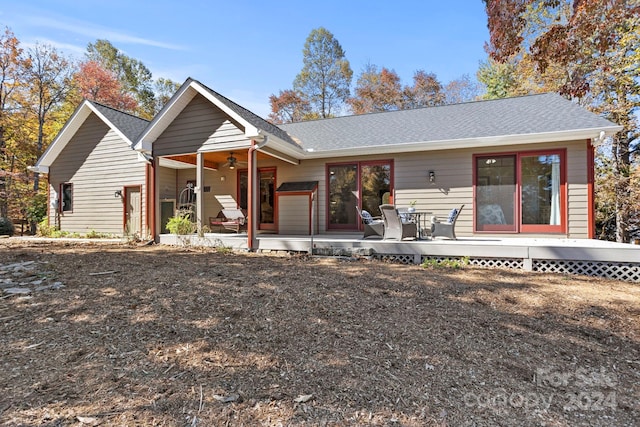 back of house with ceiling fan