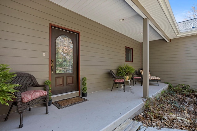 doorway to property with a patio area