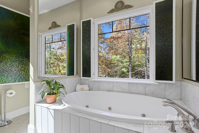 bathroom featuring tiled bath and tile patterned flooring