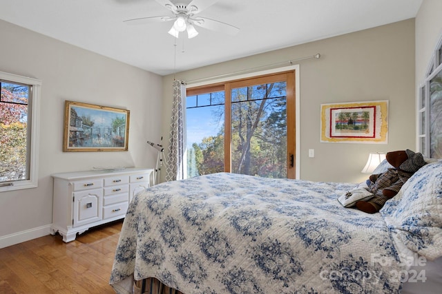 bedroom with light hardwood / wood-style flooring and ceiling fan