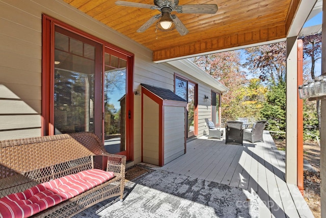 wooden terrace featuring ceiling fan