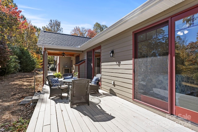 wooden terrace featuring ceiling fan