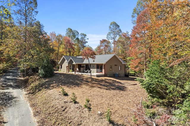 back of house featuring a porch