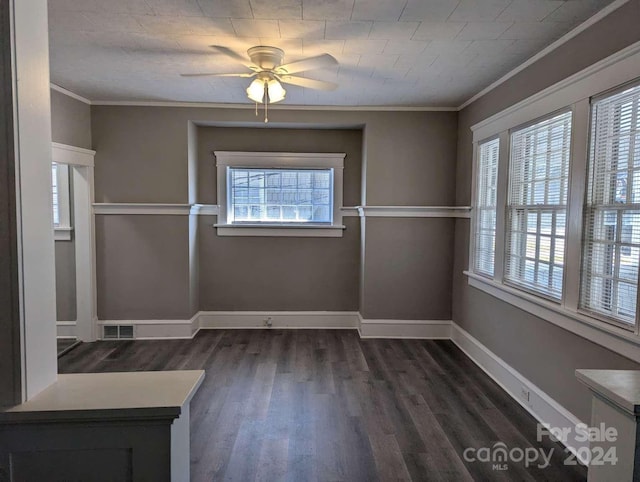 unfurnished dining area featuring crown molding, dark hardwood / wood-style flooring, and ceiling fan