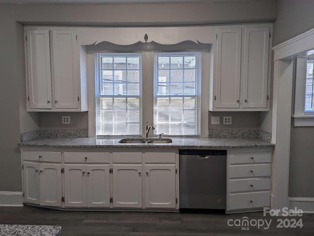 kitchen featuring light stone countertops, dark hardwood / wood-style flooring, stainless steel dishwasher, sink, and white cabinets