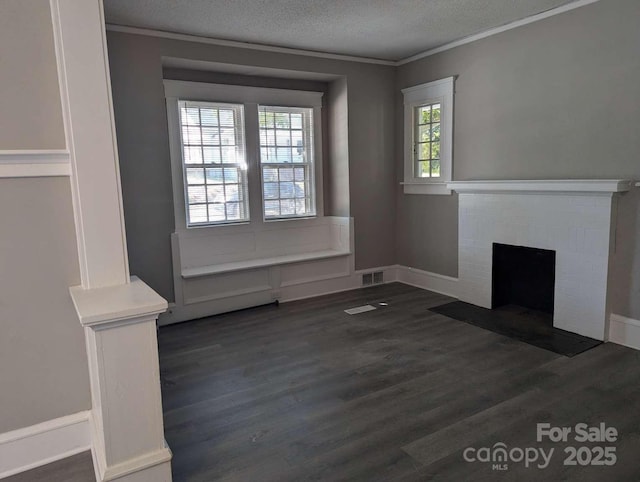 602 W Council St, Salisbury, NC 28144 - unfurnished living room with dark wood-style floors, a textured ceiling, a fireplace, and ornamental molding