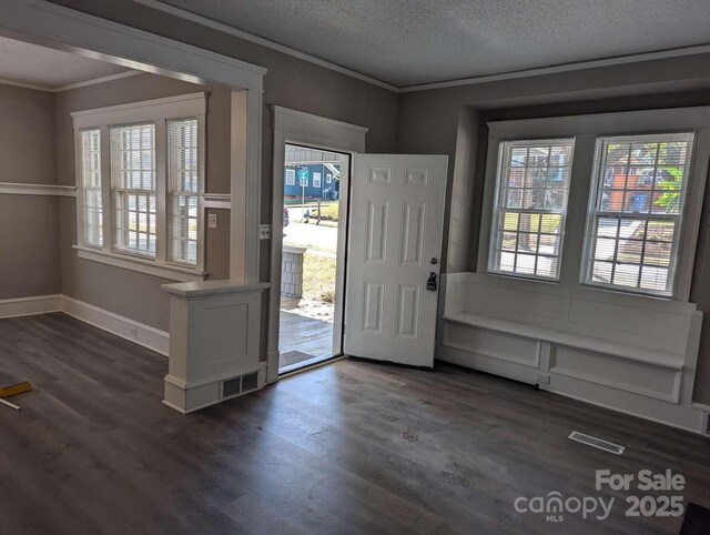 602 W Council St, Salisbury, NC 28144 - entryway featuring ornamental molding, dark wood finished floors, and a textured ceiling