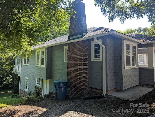 602 W Council St, Salisbury, NC 28144 - view of side of home featuring a chimney and a shingled roof