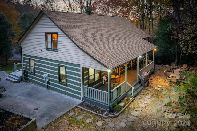 back of house with covered porch