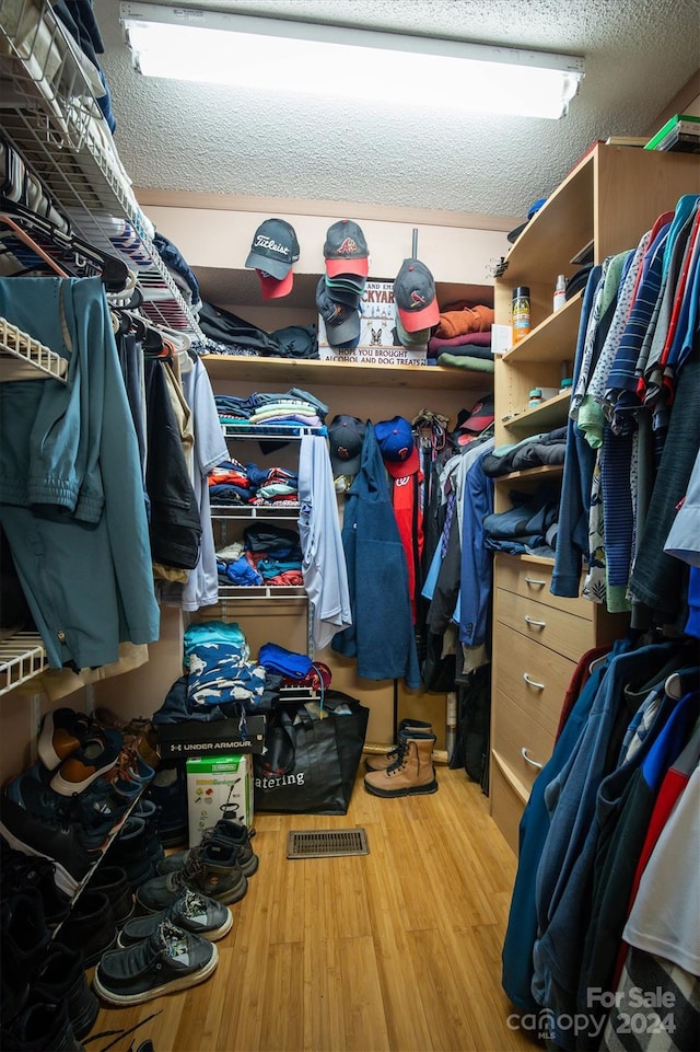 walk in closet featuring hardwood / wood-style floors