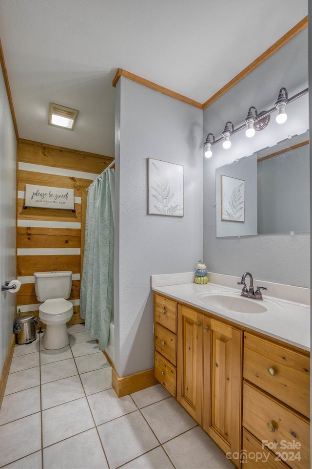 bathroom with toilet, tile patterned flooring, a shower with curtain, crown molding, and vanity