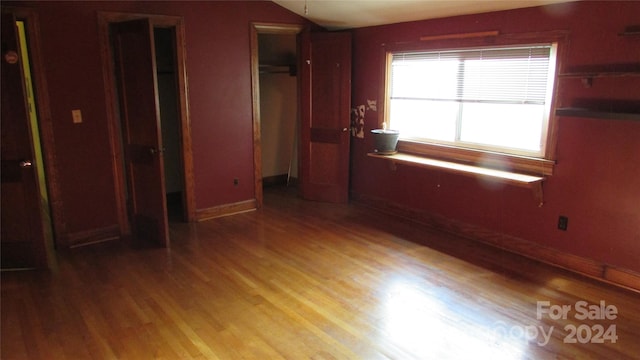 unfurnished bedroom with light wood-type flooring